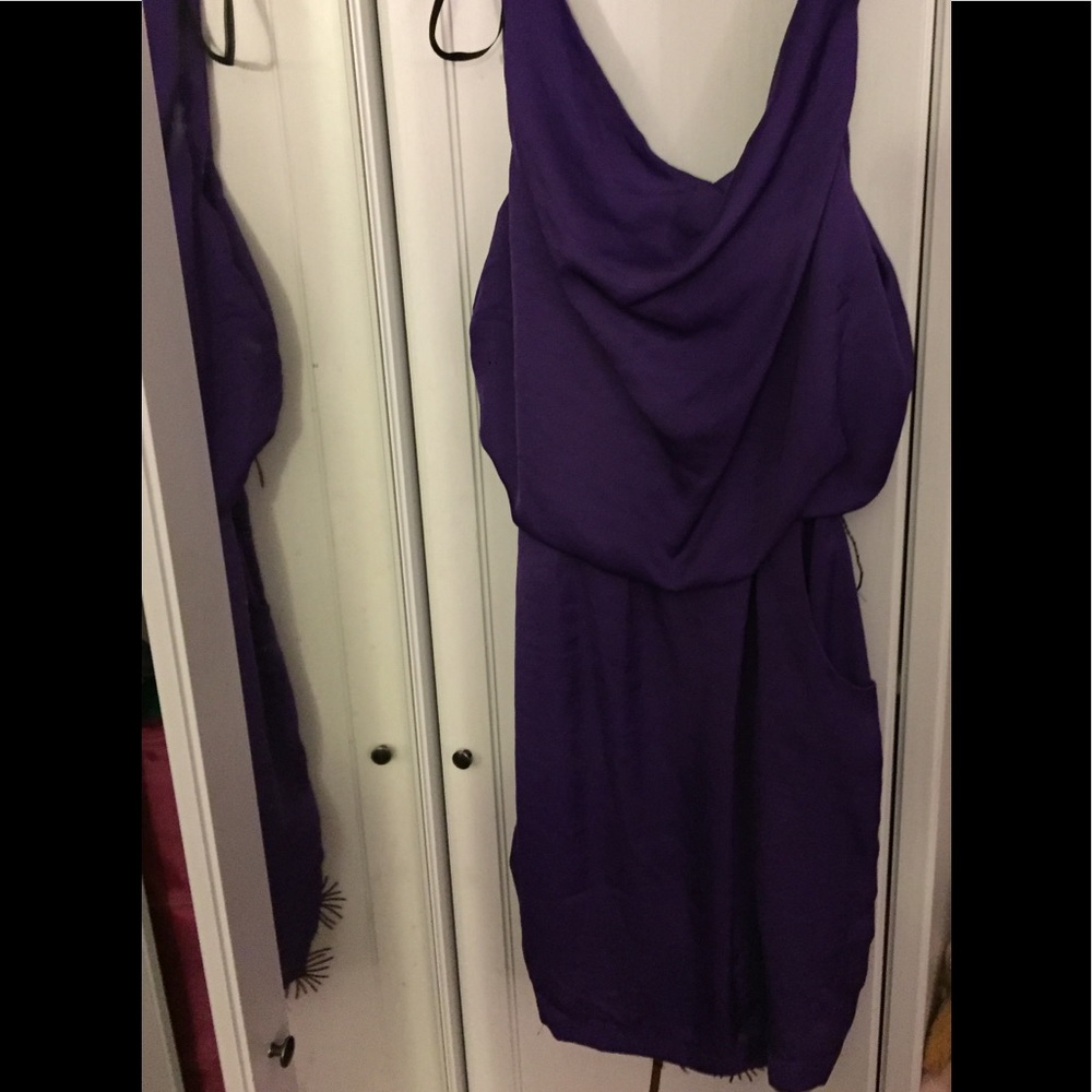 Purple dress has pockets